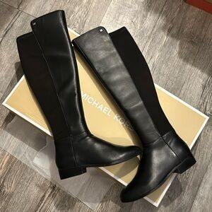 Michael Kors knee high black leather boots.